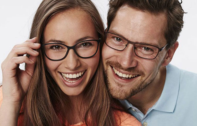 Happy couple with their eyeglasses
