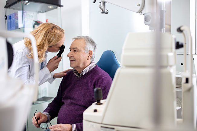 Old man getting an eye exam